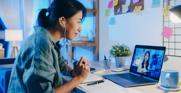 asia-businesswoman-using-laptop-talk-colleagues-about-plan-video-call-meeting-living-room